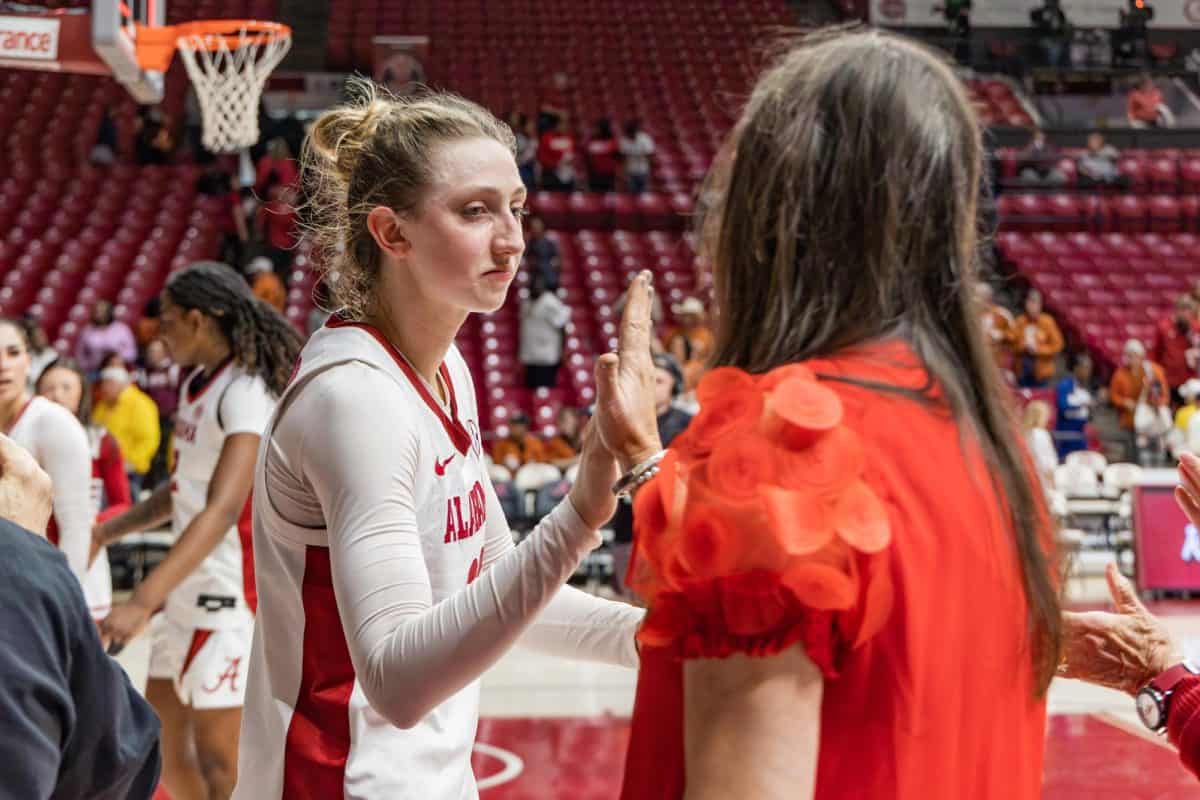 Alabama guard Karly Weathers (#22) high-fives a fan after the game versus Texas on March 1, 2026.