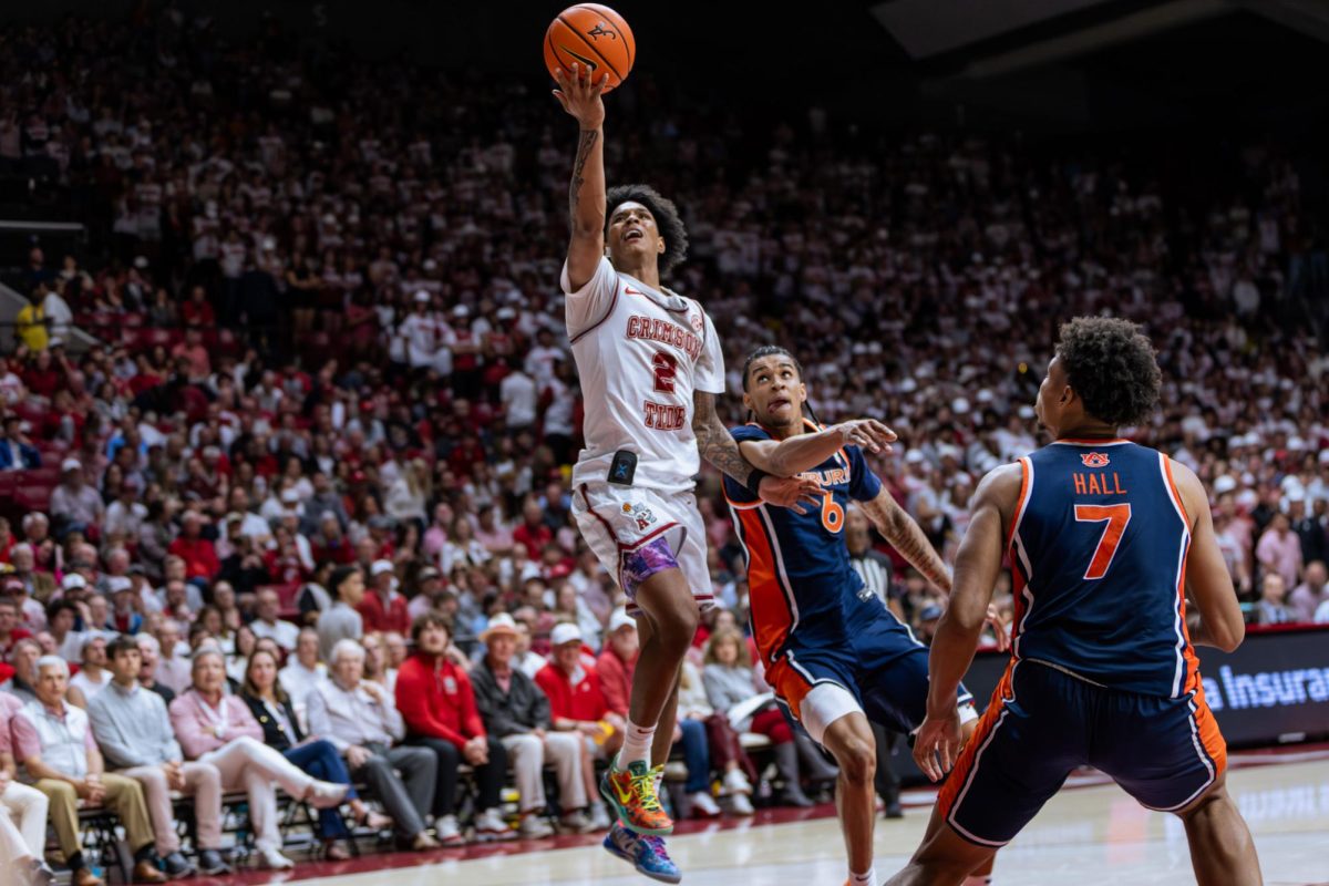 Alabama guard Aden Holloway (#2) jumps for a shot against Auburn on March 7, 2026 in Coleman Coliseum. 