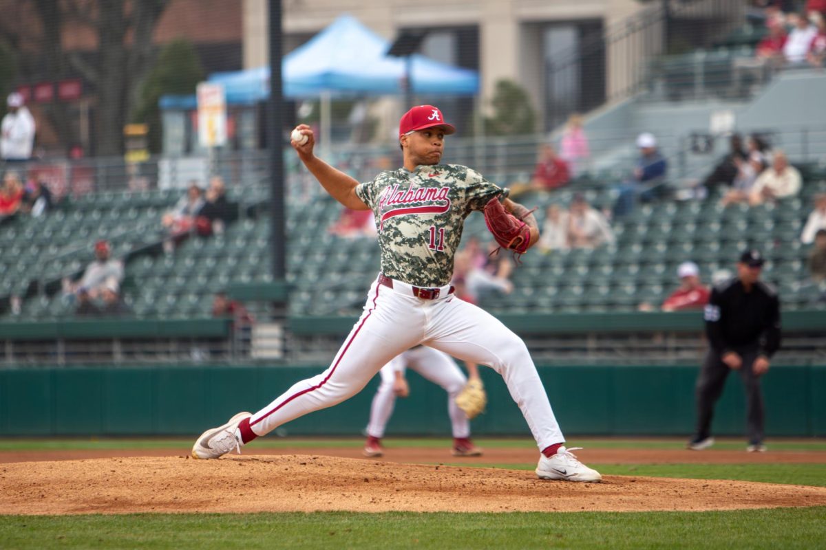 Alabama pitcher Myles Upchurch (#11) pitches the ball against Washington State on Feb. 15, 2026, at Sewell-Thomas Stadium.