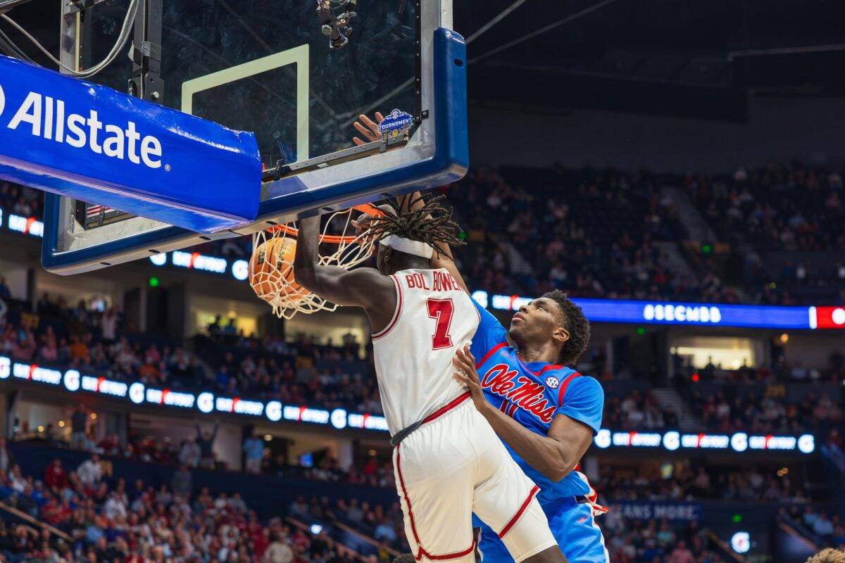 Alabama forward Taylor Bol Bowen (#7) dunks against Ole Miss. 