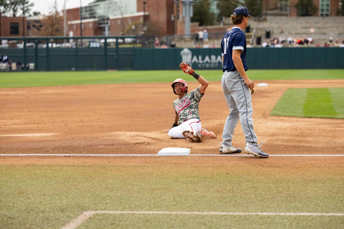 Alabama infielder Justin Lebron (#1) slides to third base against North Florida on March 6, 2026, in Tuscaloosa, AL. 