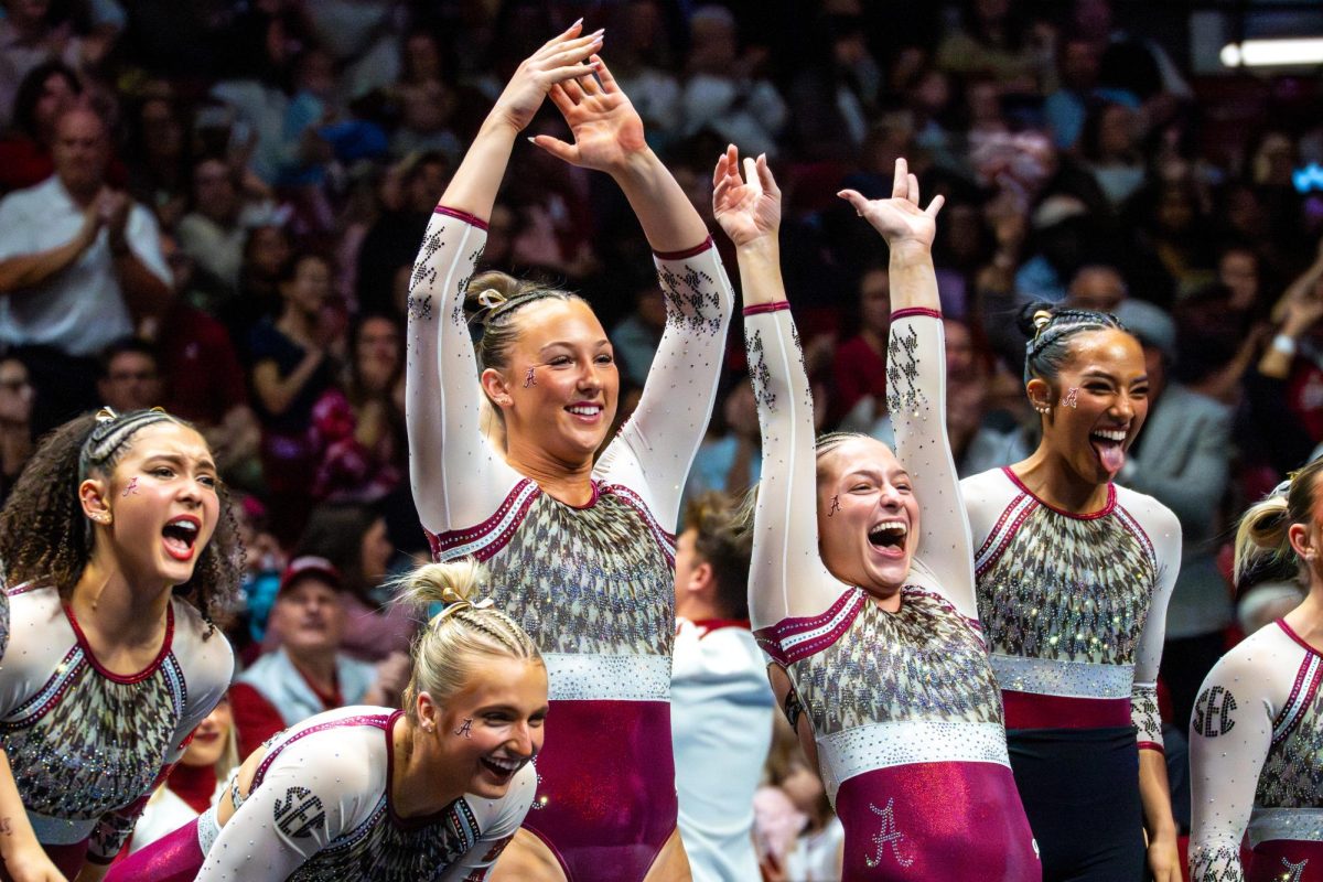 Alabama gymnasts celebrate during the meet versus Georgia on March 13, 2026, in Coleman Coliseum. 