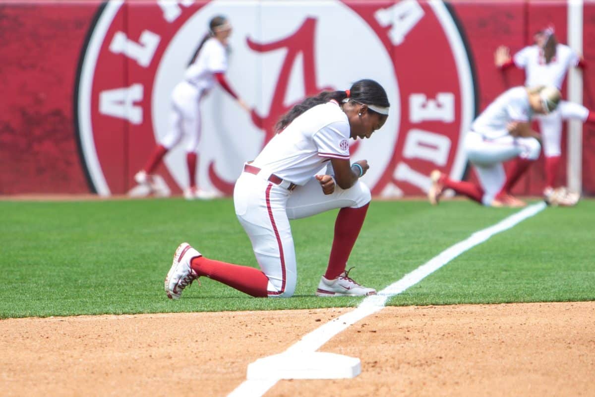An Alabama softball player prays before the game against Kentucky on April 18, 2026, at Rhoads Stadium.