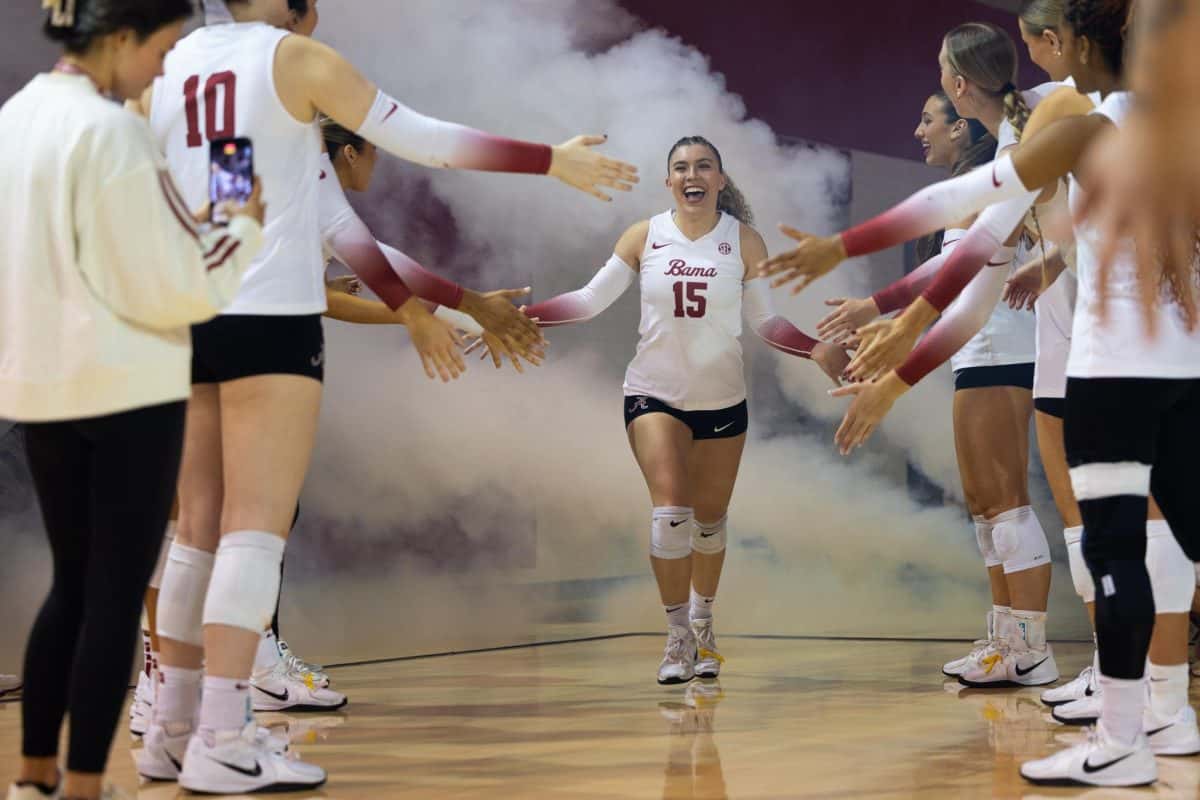 Alabama volleyball player Lily Hopkins (#15) runs out before the game against Missouri on Nov. 16, 2025, at Foster Auditorium.