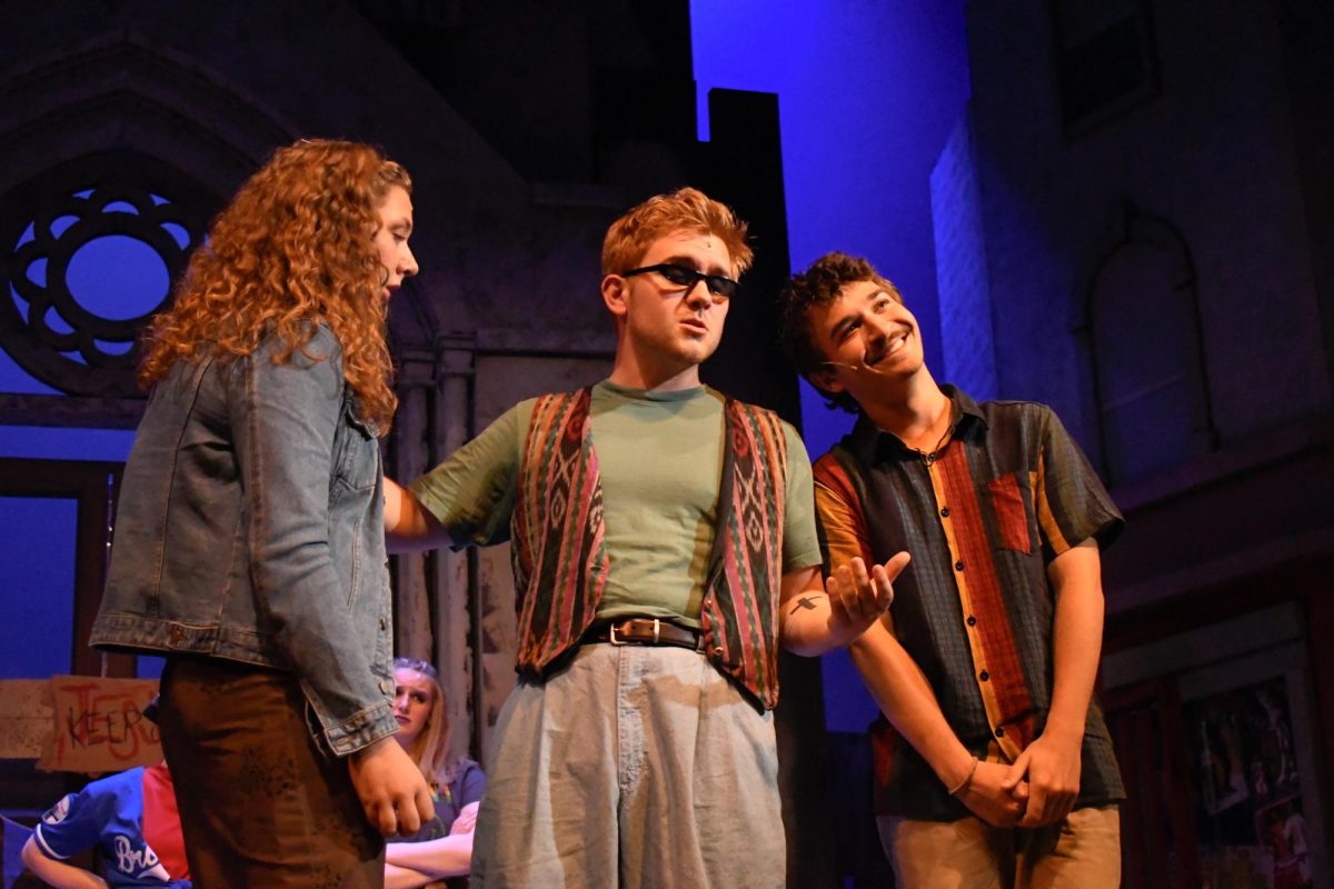 Flowers, center, gives his humorous impression of Don Corleone in "Godspell."