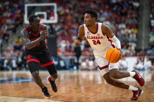 Former Alabama forward Brandon Miller (#24) dribbles the ball against San Diego State in the Sweet Sixteen round of NCAA March Madness on March 24, 2023, in Louisville, KY.