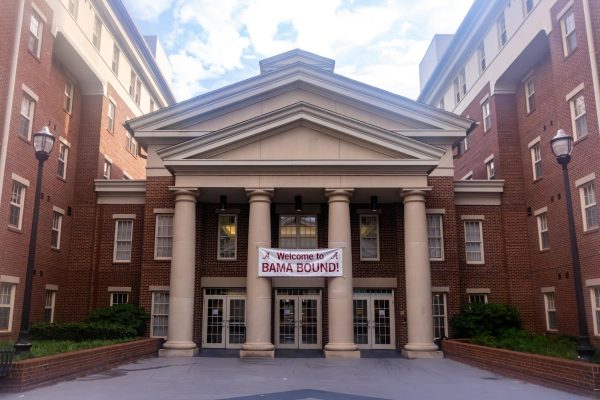 A sign for Bama Bound hangs between dorms on May 29, 2026.