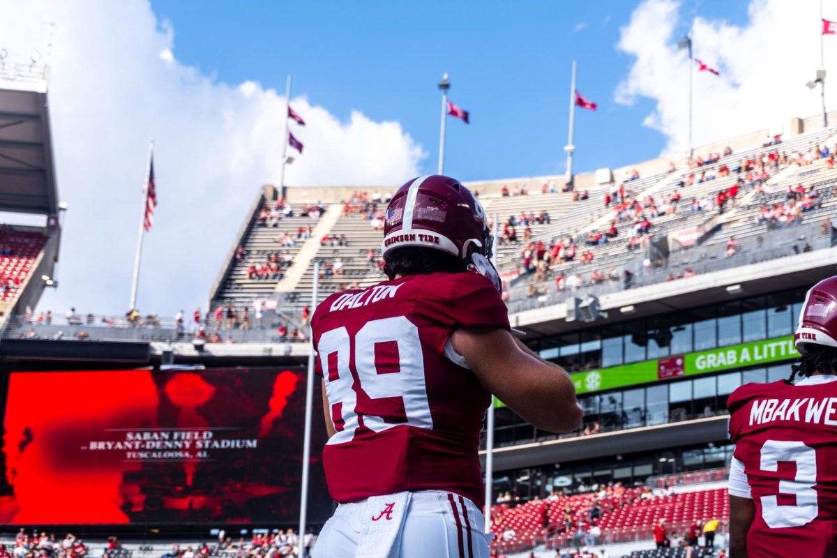 An Alabama football player walks onto the field for warm-ups against Eastern Illinois on Nov. 22, 2025 at Bryant-Denny Stadium.