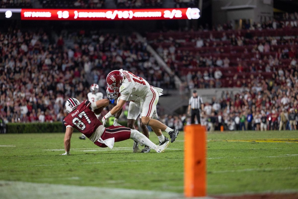 Alabama defensive back Bray Hubbard (#18) completes a tackle against South Carolina on Oct. 25, 2025.